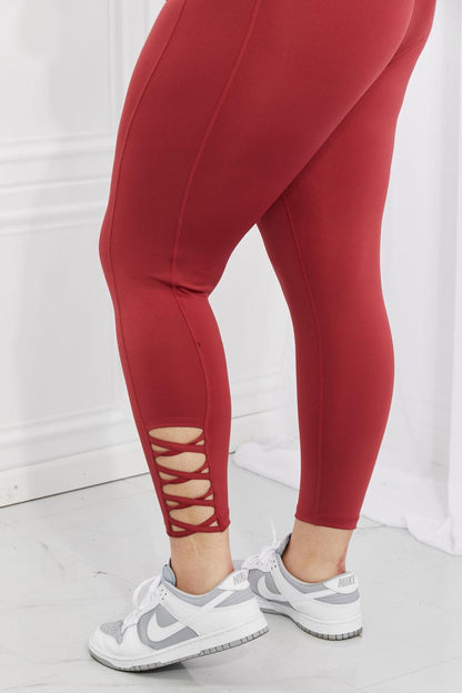 Yelete Ready For Action Full Size Ankle Cutout Active Leggings in Brick Red